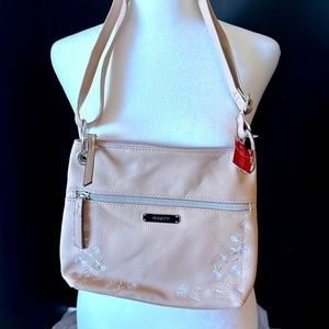 Rosetta tan purse with adjustable strap.